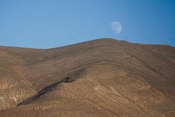 Moroccan Landscape in the atlas with the moon by daylight