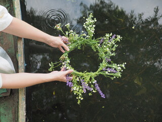 a wreath that is launched into the river