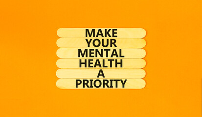 Mental health psychological symbol. Concept words Make your mental health a priority on wooden...