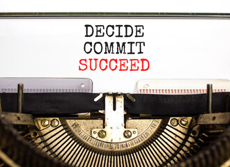 Decide commit succeed symbol. Concept word Decide Commit Succeed typed on beautiful retro old typewriter. Beautiful white paper background. Business decide commit succeed concept. Copy space.