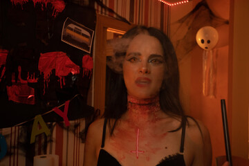 European Halloween party in a friends apartment- -Images of Young adults celebrating Halloween....