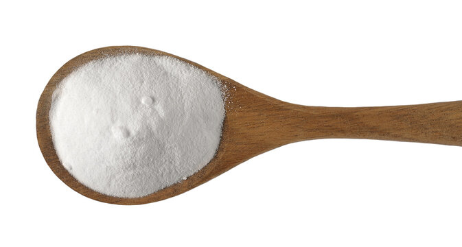 Sodium carbonate in wooden spoon, Na2CO3, soda powder isolated on white, top view