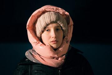 Girl in hood in winter clothes