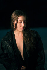 portrait of sad sodden woman in coat