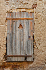 An old partially destroyed wooden door