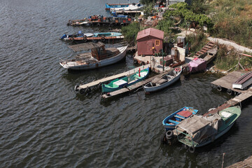 Fototapeta na wymiar Wooden fishing boats are moored in Varna