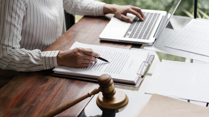 Lawyer with lawsuit meeting with client discussing with contract agreement at courtroom..