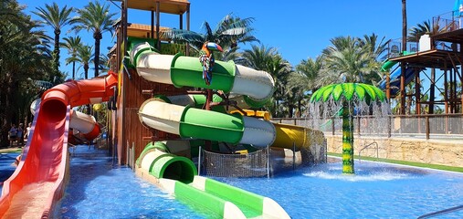 Water park for children in Spain. Open air water park. Children's water slides made of plastic....
