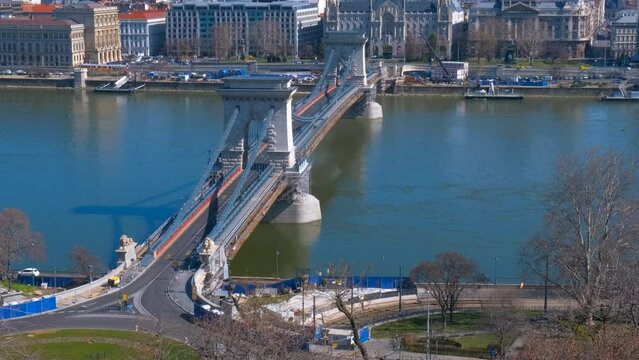 Hungarian secheni bridge. A cute chained Secheni bridge over river in the sun light.