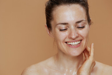 happy modern female with wet face washing - obrazy, fototapety, plakaty