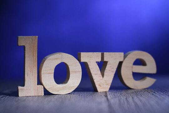 Love, text words typography written on wooden lettering, life and business motivational inspirational