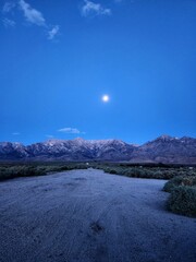 Moon over mountains in Big Pine, California