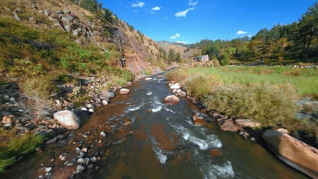 Rocky Mountain Rush: FPV Drone Dive above the river.