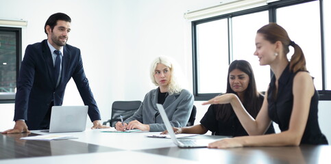 Business People, Successful business professionals. Diverse team celebrating business success at meeting.