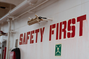 safety warning sign on the bulkhead at the muster station of a ship