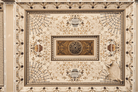  Abandoned soviet spa resort (sanatorium) Shakhter (Miner), in Tskaltubo, Georgia. Painted celling in luxurious ancient hall. Stalin Empire style