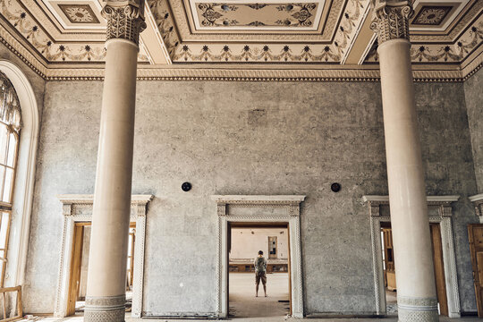  Abandoned soviet spa resort (sanatorium) Shakhter (Miner), in Tskaltubo, Georgia. Luxurious ancient hall with columns, painted ceiling, arched windows. Stalin Empire style