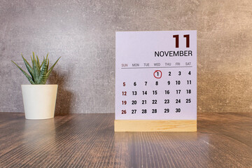November 1st. Image of november 1 wooden color calendar on white brick wall background. empty space for text.