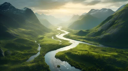  An areal view of a lush landscape with a river snaking through a valley.  © Erik