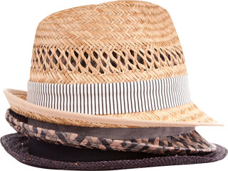 Stack of classic straw fedora style hats isolated