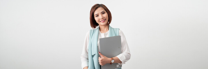 Beautiful young asian business woman holding clipboard over white banner background
