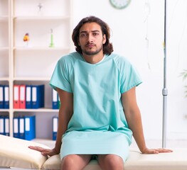 Young male patient in blood transfusion concept