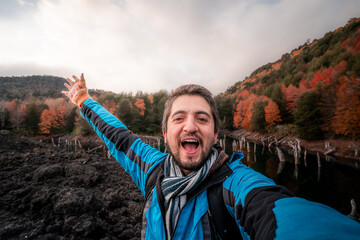 person taking a selfie in an autumn park, conguillio national park, araucania andina, araucania region, Chile