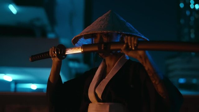 Woman In A Kimono Unsheathes Her Katana