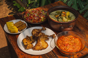 fried chicken with cracker, serve with sambal matah, sayur lodeh and tahu tempe, indonesian dish