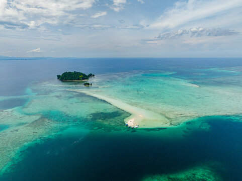 Aerial view of Sandbar and Turtle Island surrounded by azure water and reefs. Barobo, Surigao del Sur. Philippines.