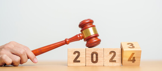 2023 chcnge to 2024 year block with judge gavel on table. Law, lawyer, judgment, justice auction...
