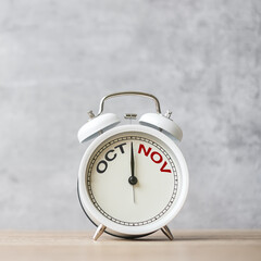 Hello November Changed from October month with vintage alarm clock on table background. Calendar, Monthly, New Start, Resolution, Goals, Plan, Action and Mission Concept