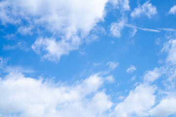 Blue sky and white cirrocumulus clouds texture background. Blue sky on sunny day. Summer sky. Cloud formation. Fluffy clouds. Nice weather in summer season. Weather pattern. Atmospheric phenomenon.