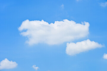 beautiful blue sky and white fluffy group of clouds with sunrise in the morning, natural background