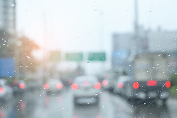 traffic on highway with cars on rainy day, blur background