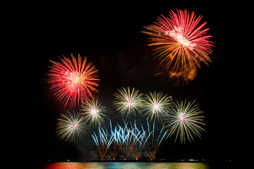 fireworks of various colors at night with celebration and anniversary concept