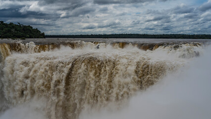 The impressive famous Devil's Throat Waterfall. Powerful streams of water plunge into the abyss...
