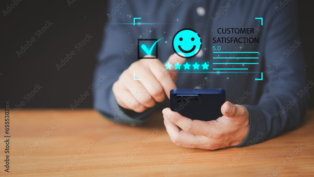 Leinwandbilder client hands using a mobile phone with pop up smile face icon for feedback review satisfaction servi