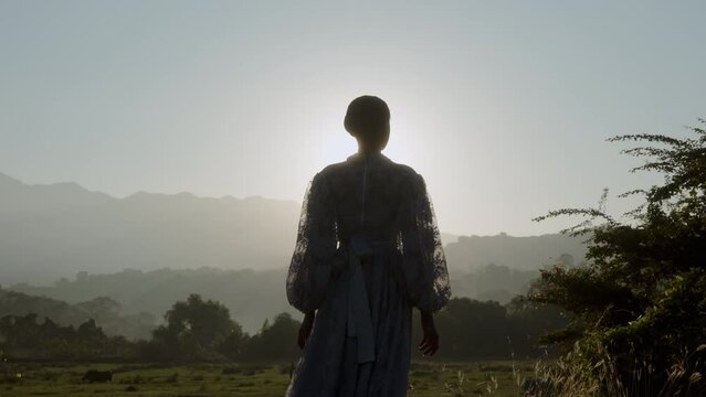 Silhouette Of Woman Against The First Dawn Of Light