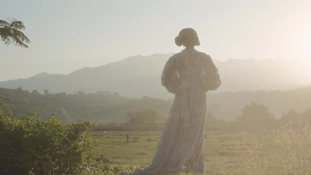 Woman And Distant Mountains At First Light