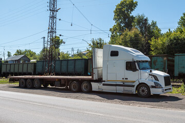 Fototapeta na wymiar Truck with a semitrailer at a freight railway station