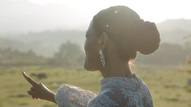 Lady With Dangle Earrings Basking In Sunlight