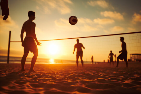 Male beach volleyball players play a volleyball match on the beach