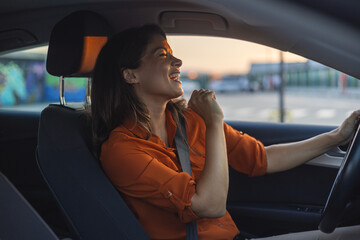 Close-up portrait of her she nice-looking attractive lovely brunette charming glad cheerful cheery girl riding new car enjoying having fun listening music singing pop rock - Powered by Adobe
