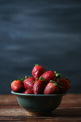 Ripe Strawberries in Gray Bowl Dark Moody Blue Background