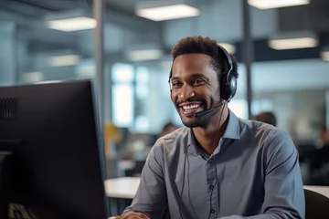 Rolgordijnen Portrait of a Handsome African Man, Customer Service Operator, Call Center Worker Talking Through Headset with Customer in Modern Office. © CYBERUSS