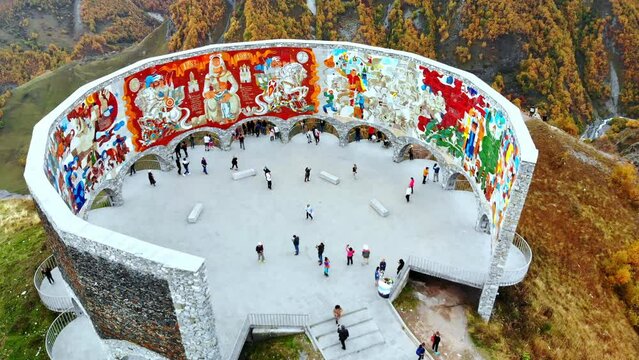 An aerial view of the Russia-Georgia Friendship Monument located on the Georgian Military Road overlooking Devil's Valley in the Caucasus. Gudauri.