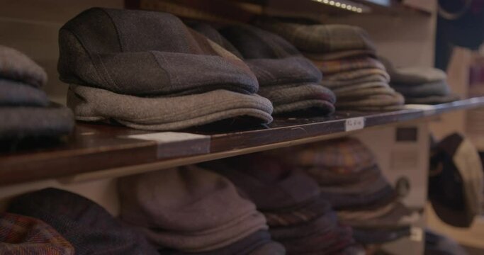 Wide Slow Motion of Flat Caps on a Shelf