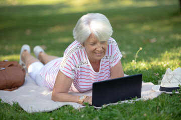 portrait of an elderly woman in the spring park