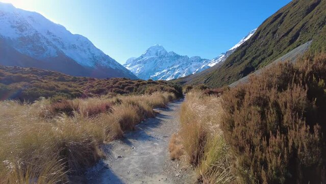 Point of view footage of an tourist who hikes the famous Hooker valley trail at the base of Mt Cook in the southern alps in New Zealand in winter